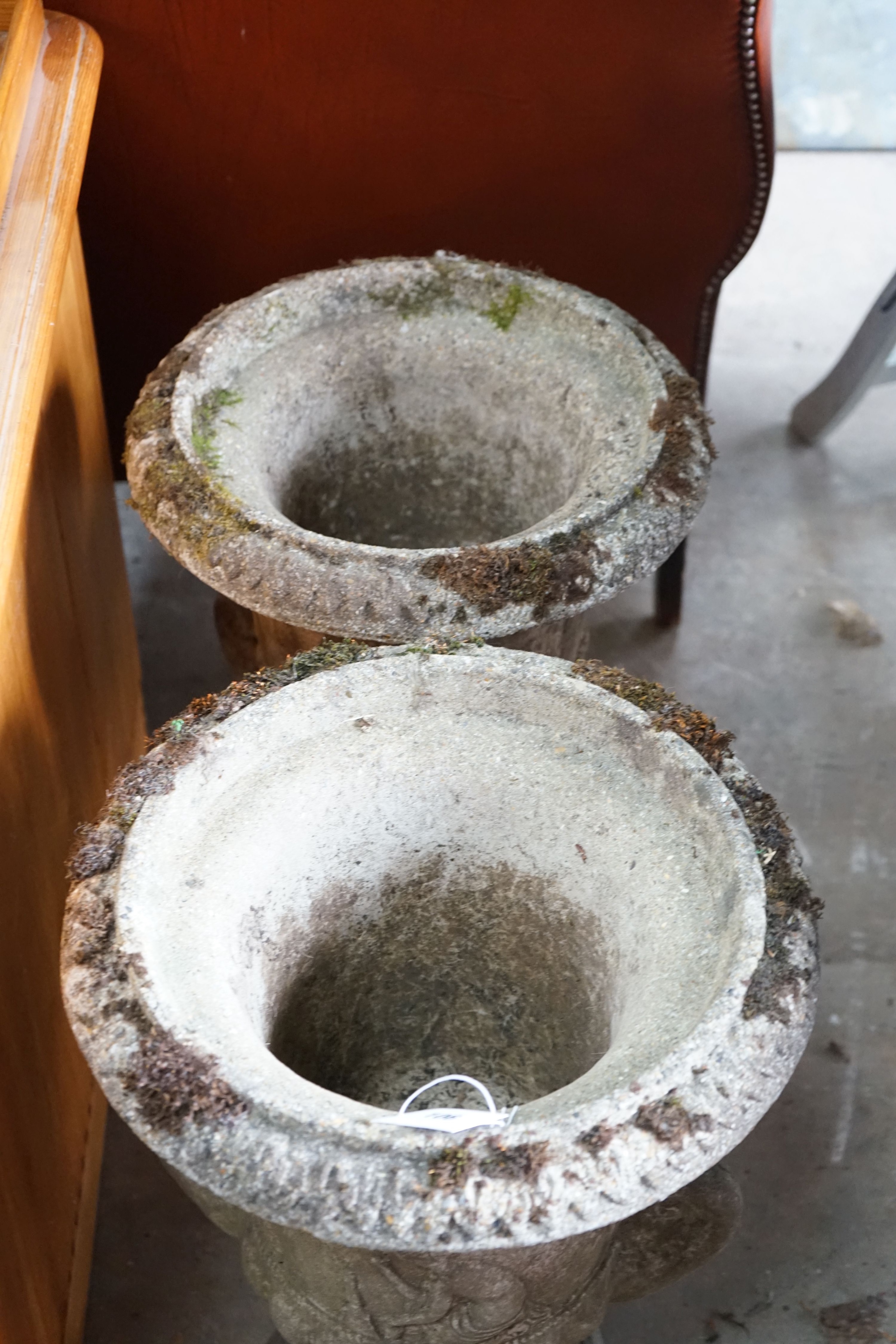 A pair of reconstituted campana garden urns, diameter 40cm, height 62cm
